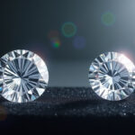 a pair of diamonds on a black surface